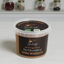 Įkelti vaizdą į galerijos rodinį, Container of Saules Lykė organic sea buckthorn berry fiber on kitchen countertop with spice jars in background